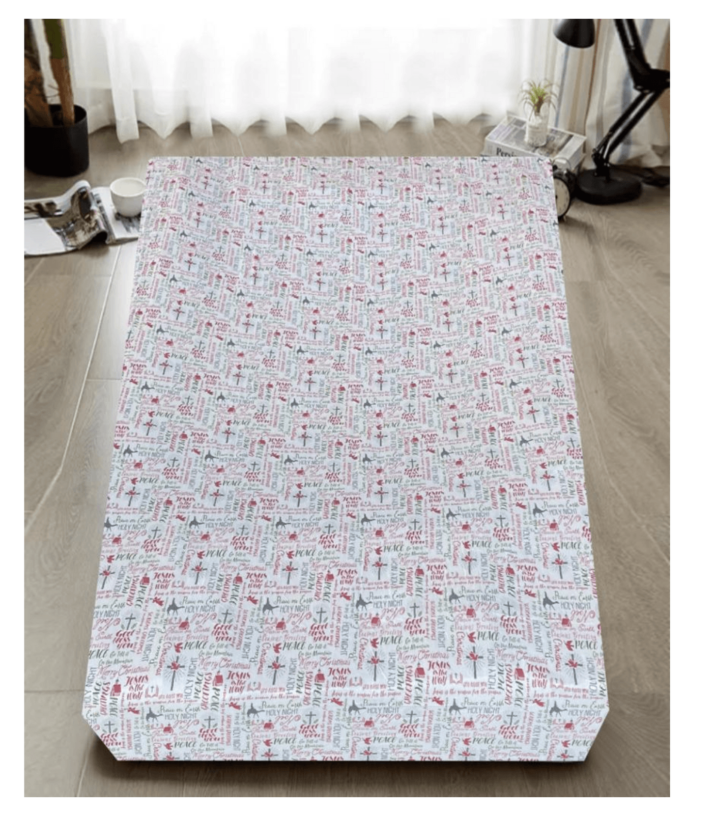Queen size mattress with inspirational text and cross pattern in a modern bedroom setting