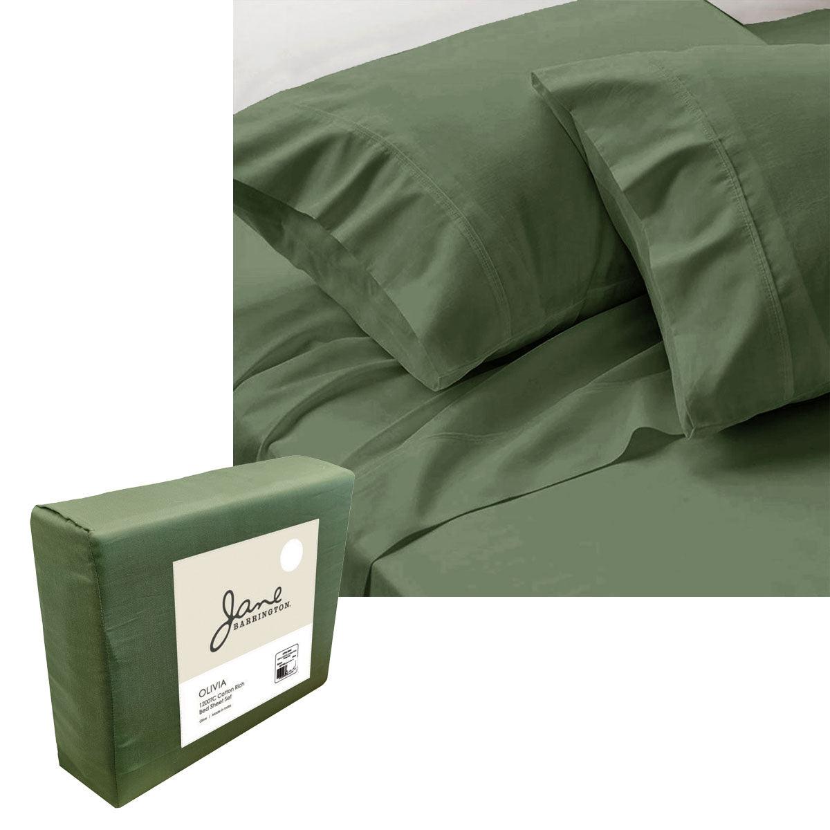 Olive green 1200 thread count sheet set with pillowcases and packaging on bed